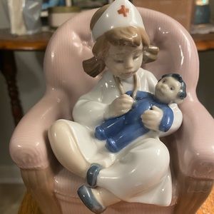 NAO by Lladro “Playing Nurse”